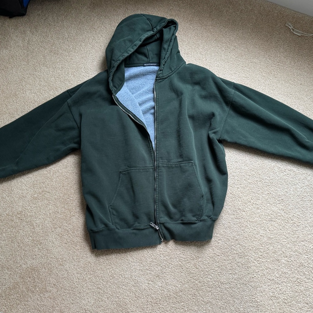Brandy Melville dark green sweatshirt.
